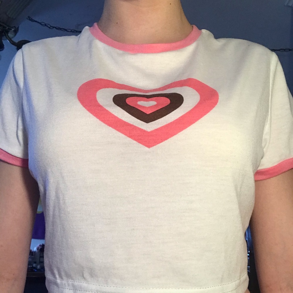 A pink and white heart baby tee